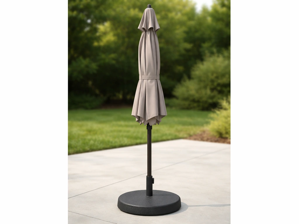 Heavy patio umbrella base securely holding the umbrella in place outdoors, with no wobble or tipping.