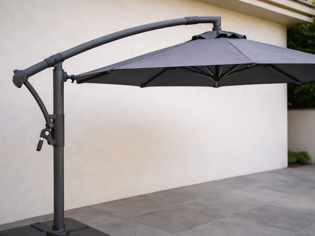 Side view of an offset cantilever patio umbrella with canopy leveled, beginning to close.